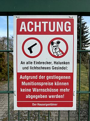 humorous German sign: Beware of trespassing!